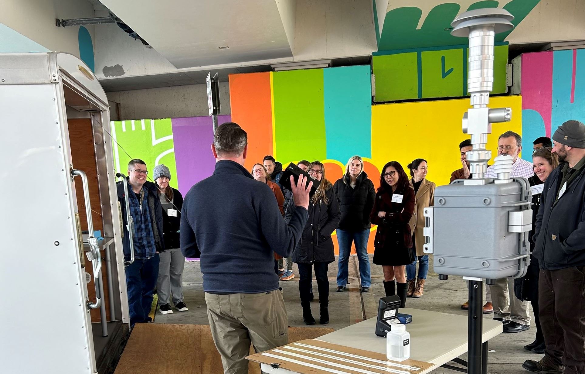 Agency staff conduct a tour of air pollution monitoring equipment